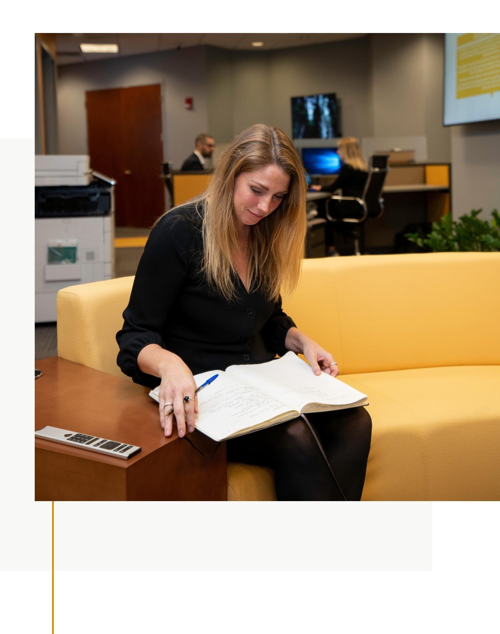 Usherwood employee taking notes in office