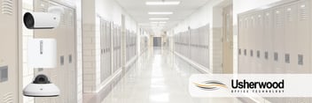 School hallway with security cameras on the left side and usherwood logo on the right