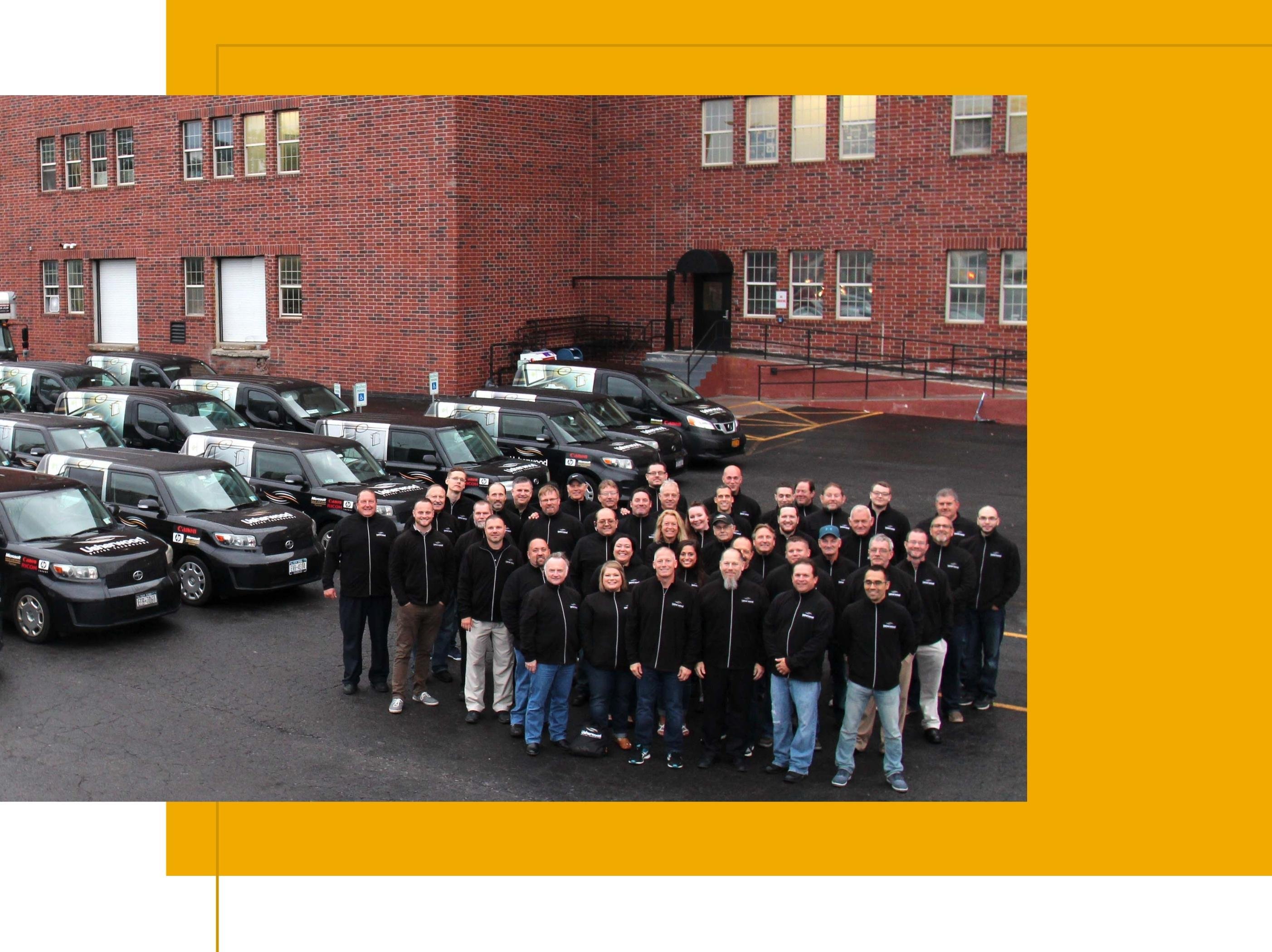 Fleet of Usherwood vehicles and service technicians