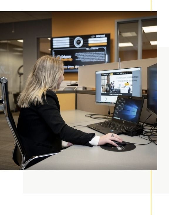 Woman at her computer smiling 