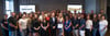 50 people gathered together with a 50th anniversary award being presented to Lou Usherwood 