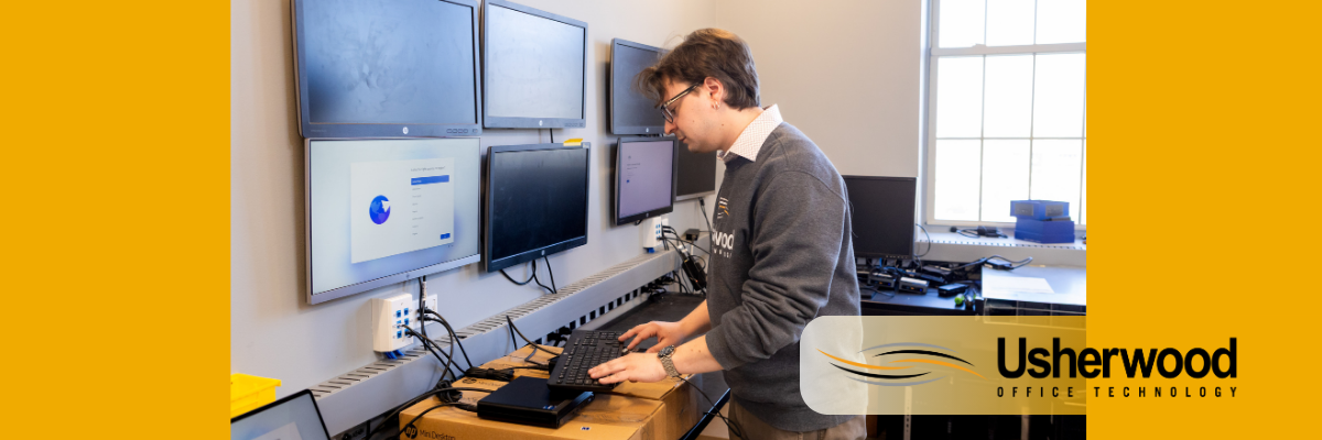person on keyboard with a bunch of screens in front of him practicing zero trust